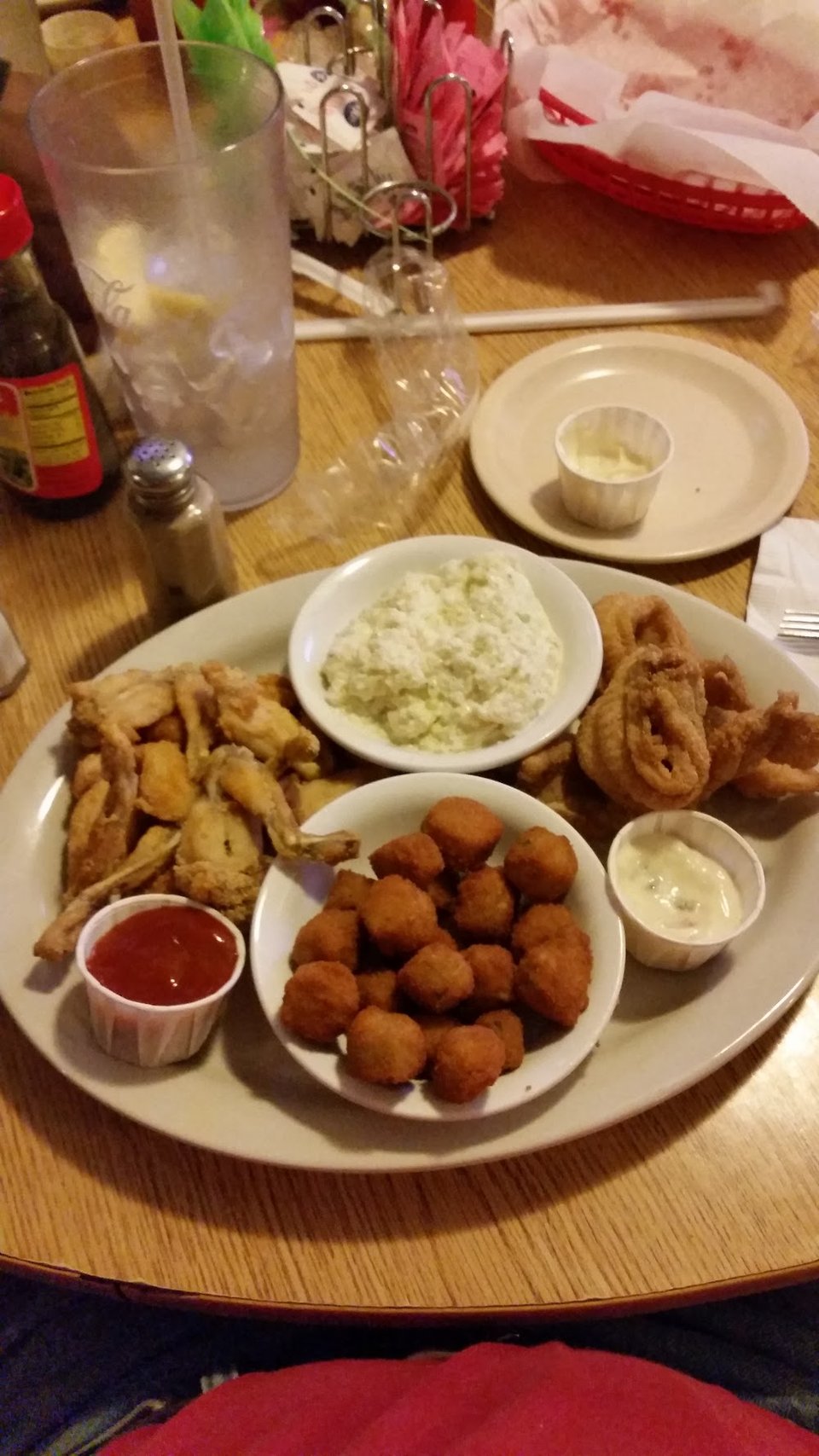 Printed menu with catfish, steaks, and sandwiches.
