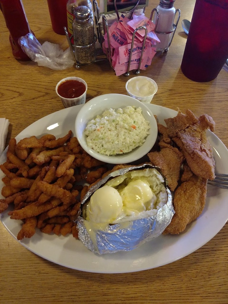 Printed menu with catfish, steaks, and sandwiches.